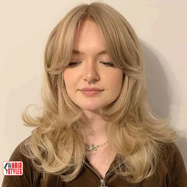 7. Layered Wolf Cut with Curtain Bangs | Most Beautiful Wolf Cut Hairstyles For This Winter